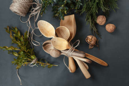 Wooden spoons on dark black background.の写真素材