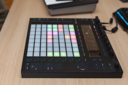 Producer makes a music on professional production controller with push button padsの写真素材