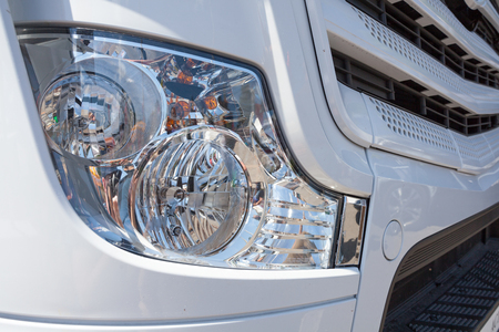 Close up detail  of white truck headlightの写真素材