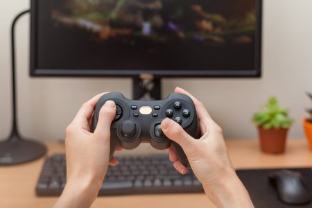 Woman playing on the joystick in a game console