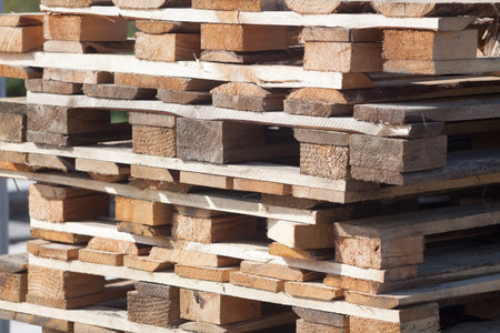 Stacks of Wooden pallets for industrial transportation by trucks