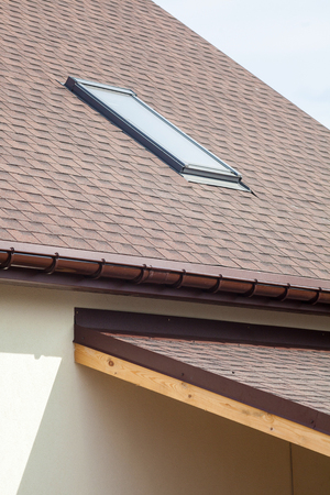 Asphalt shingles or bitumen tiles on the terrace and rooftop outdoor.の写真素材