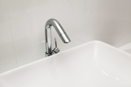 Element of bathroom interior. New wash basin, white sink and tile.の写真素材