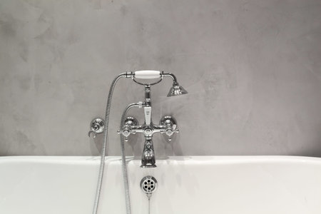 Bright bathroom with new textured wall and plumbing.