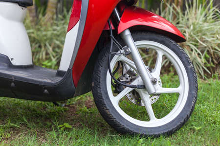 Front end of a red scooterの写真素材