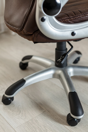 Close-up of new brown office chairの写真素材