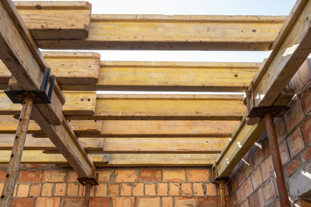 Low angle top view and close up photo of formwork construction. Unfinished roof wooden plank on...