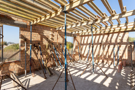 Formwork construction concept. Low angle top view photo of big empty room in incomplete family house...