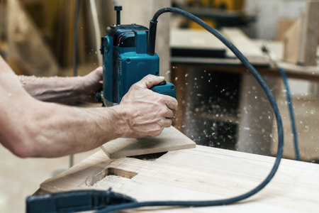Hobby wood concept. Cropped photo of cabinetmaker craftsman handcraft plunge tool in wood make...