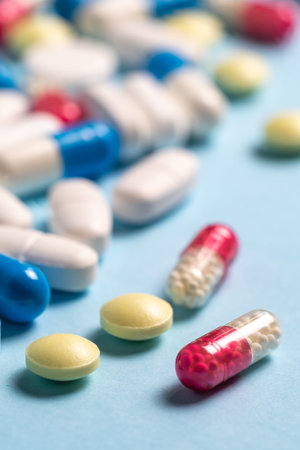 Treatment and healthcare concept. Selective focus and macro view of set with different pills against...