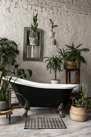 Vertical photo of elegant bathroom with stylish interior design, textile rug on floor, modern bath...
