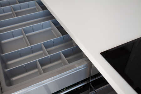 High angle view of element modern cabinet furniture in modern kitchen with empty organized utensil drawer for fork, spoon and knivesの写真素材