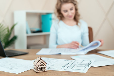 New house or reconstruction apartment concept. Professional designer making an architect drawing and...