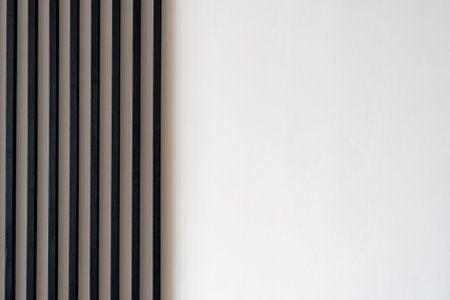 Close up of decorative panel, vertical wooden planks in part of minimalist interior design against...