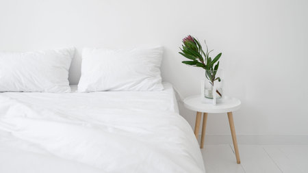 White minimalist apartment with modern interior design. Banner view of comfort bedroom with...