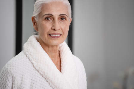 Portrait of pretty aged woman posing in front of camera. Beauty concept. Result of anti-aging cosmetics. Healthcare industry. Skin care idea. Spa treatmentの写真素材