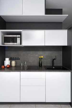 Nordic style kitchen interior design in black and white tones. home comfort concept. Place for...