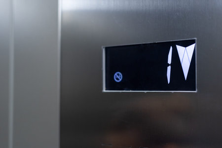 Closeup of modern elevator electronic panel showing first floor. Passenger lift. Movement within...