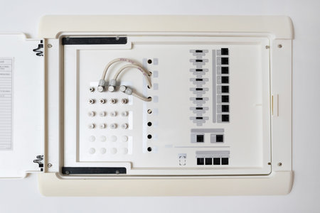 Close up view of opened electric shield with different wires and ports. Outlet panel with internet,...