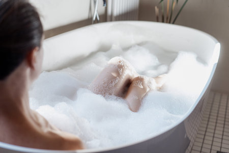 Enjoyment and relaxation in spa hotel. High angle view of calm young woman spending morning in...