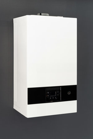 metal automatic boiler for heating house at winter season, control panel with buttons, climate system, energy efficientの写真素材