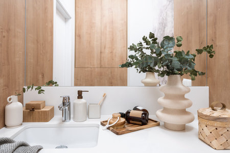 Close up view of washbasin, mirror and beauty products in bathroom. Personal accessories, soap...