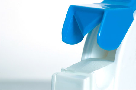 A macro shot of a medical tape despenser.