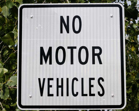 A black and white no motor vehicles sign.の写真素材