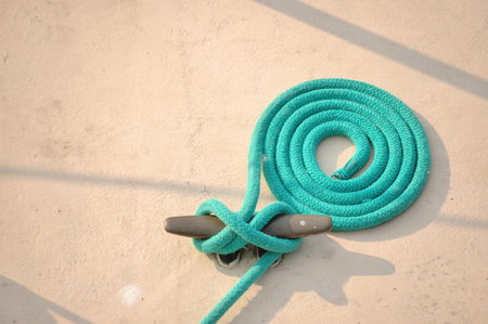A corded up ship rope at a dock.