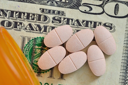 A macro closeup of Prescription drugs on a fifty dollar bill.の写真素材