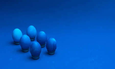 Classic blue easter eggs on bottle cup stand. easter concept. isometric layout. place for textの写真素材