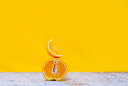 Balancing stack of fresh sliced oranges