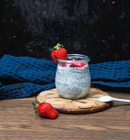 Homemade chia pudding decorated with fresh strawberry. Healthy foodの写真素材