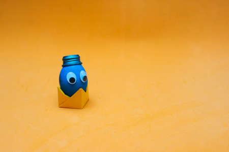 Funny easter egg with googly eyes in a hat. Easter concept. Place for textの写真素材