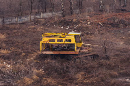Abandoned broken old yellow rustic construction crane. Rusty vehicleの写真素材