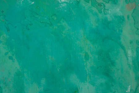 Green abstract painted cardboard sheetの写真素材