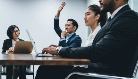 Dynamic teamwork in action! Diverse, engaged professionals collaborate in a modern setting, strategizing for success. Perfect for showcasing teamwork and innovation.の素材