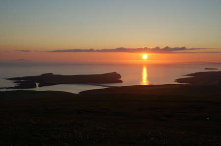 Simmer dim sunset over St NinIan's Isle in the Shetland Islandsの写真素材