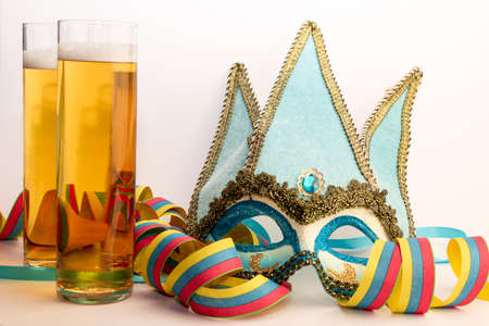 Carnival mask with beer glassesの写真素材