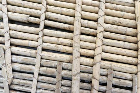 old wooden floor made of whole bamboo trunks