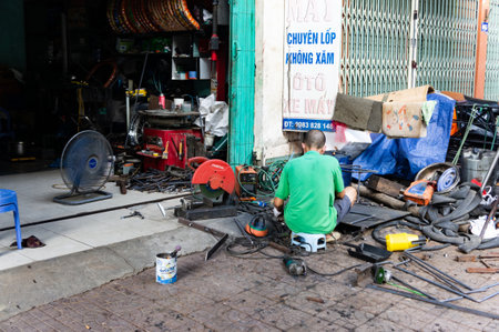Loa Chai, Vietnam - Oct 11,2019. On the streets of Vietnam. Scene welder workingのeditorial素材