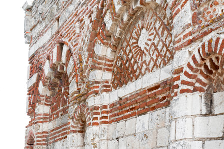Nesebar, Bulgaria, July 23, 2012. Old Town of Nesebar. Stone facade of the church. Ceramic facade inserts. Typical brick and stone masonry, authentic patterns.のeditorial素材