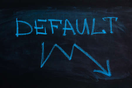 The inscription "default" on the blackboard. arrow to down. Blue chalkの写真素材