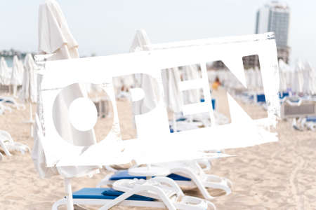 Concept Open 2020 after quarantine, COVID-19. white umbrellas on the beachの写真素材