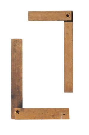 old vintage wooden machinist square measuring tool. Framing Square, Carpenters Square, isolated on white backgroundの写真素材
