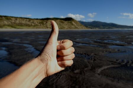 Thumbs Up on the Beachの写真素材