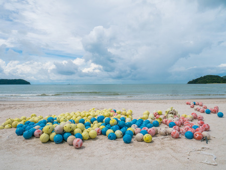 Floating Buoy on a Beach. Floating buoy ball for safety awareness an oceanの写真素材