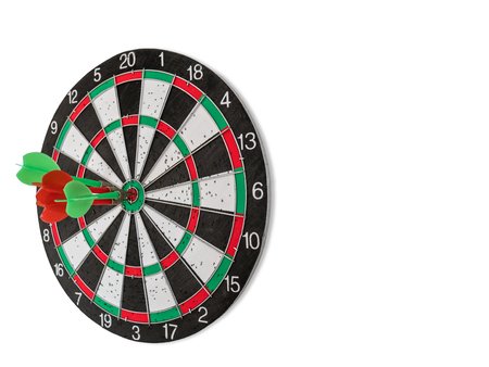 Isolated Dart Board with Holes on the Dart Board Due to Throwing Darts Multiple Times. Four Darts Hit the Red Bullseyeの写真素材
