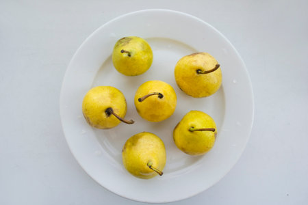Harvest of ripe natural pears on a plate