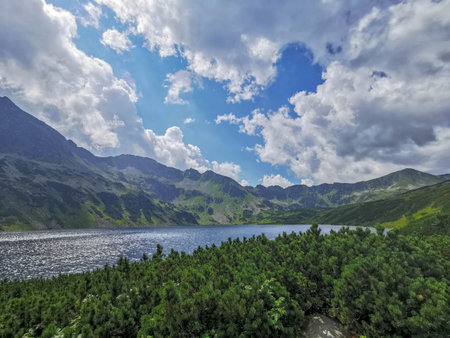Pond in the Valled of five ponds in Polish Tatra mountains visible from the trail